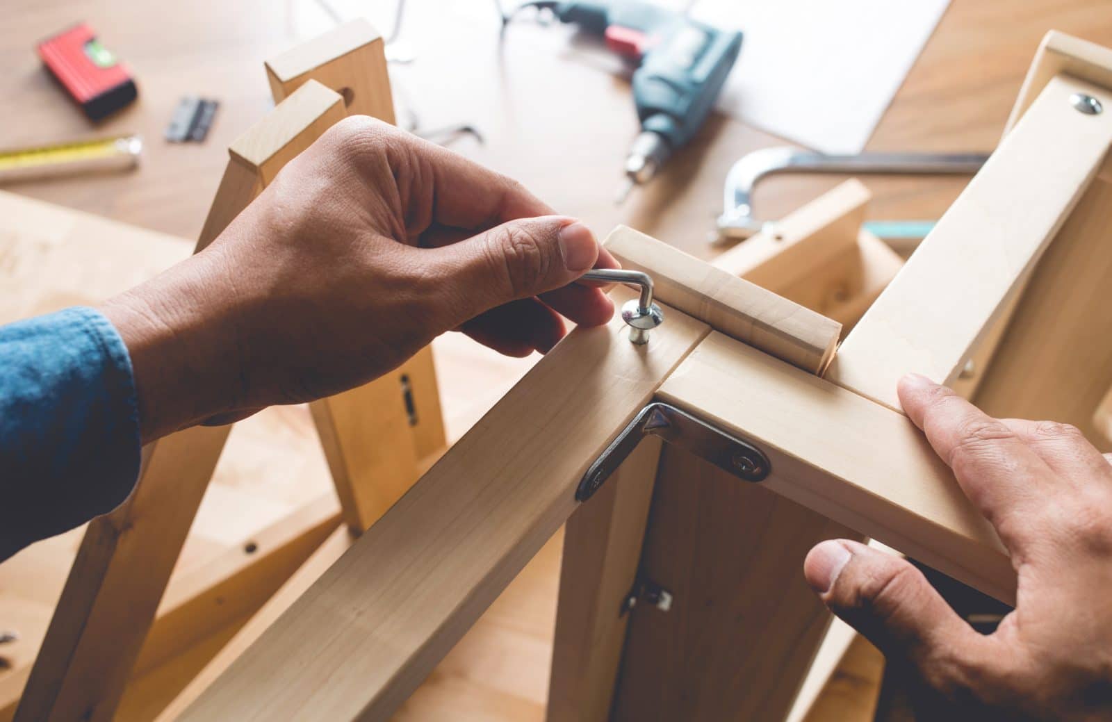 Handyman assembling Ikea furniture